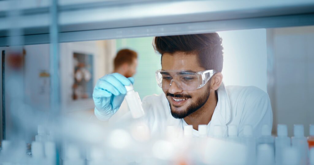 Male student of chemistry working in laboratory