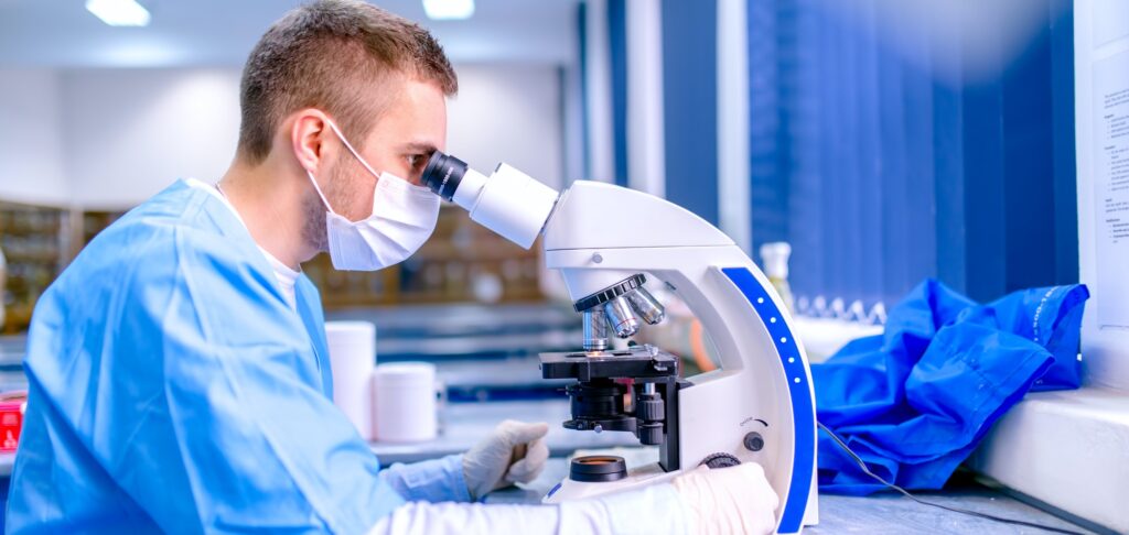 Scientist working in chemistry laboratory, examining samples at laboratory